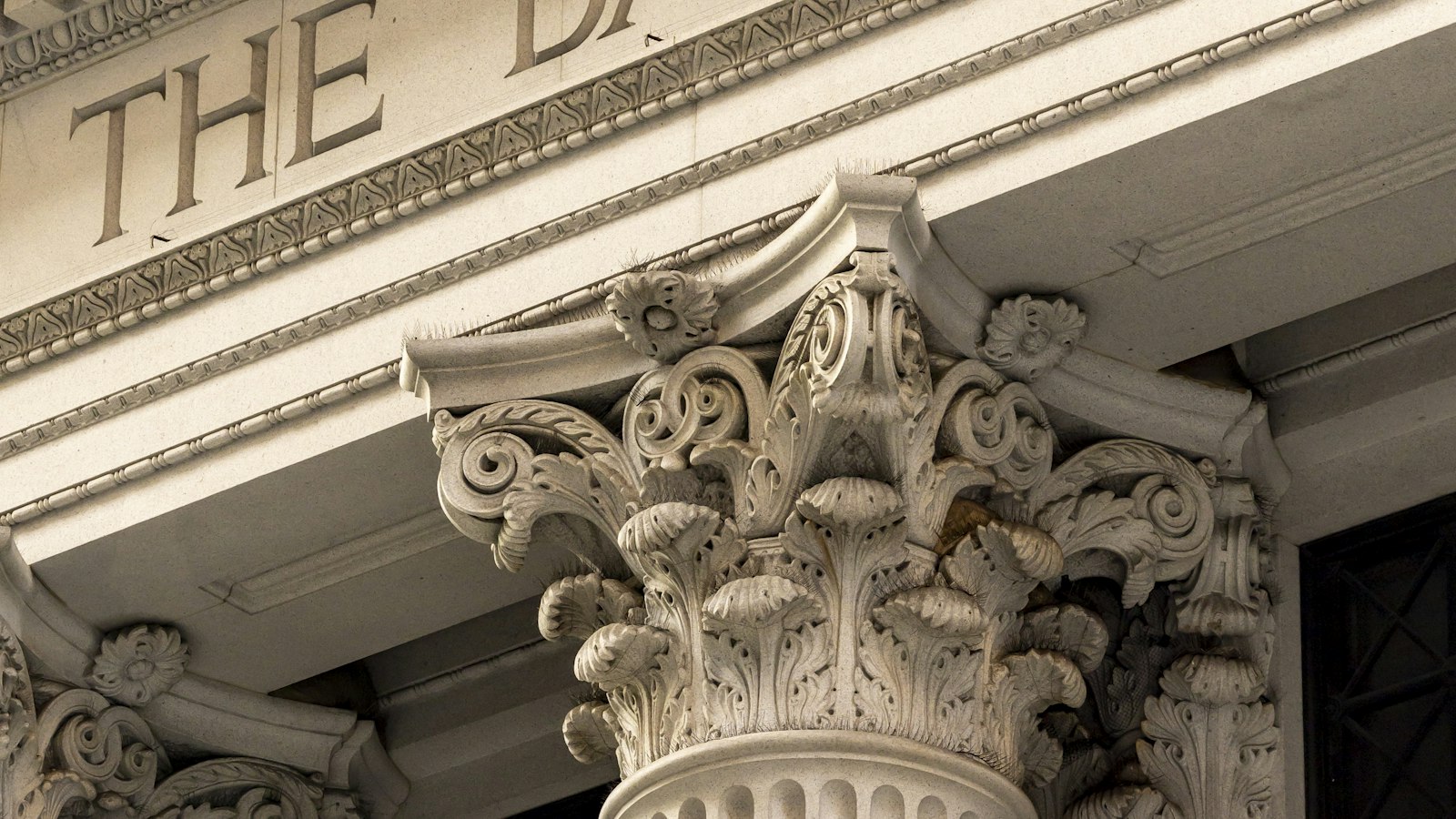 Classical bank facade with stone columns at dusk